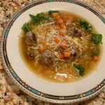Little meatballs with vegetables and pasta in a velvety broth