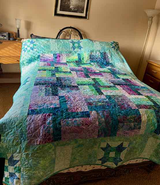 Batik fabric strips made into a quilt top